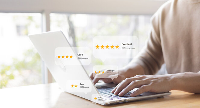 close up man use laptop to heck score and read review online website page about service and experience with many feedback and ranking score from customer for business quality and evaluation concept