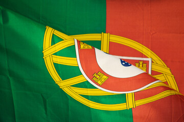 close-up view of the coat of arms on the portuguese flag detail view of the flag of portugal and...