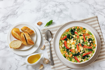 Vegetarian Minestrone with in white bowl, top view
