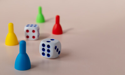 A board game of dice and chips on a light background. Time to rest.