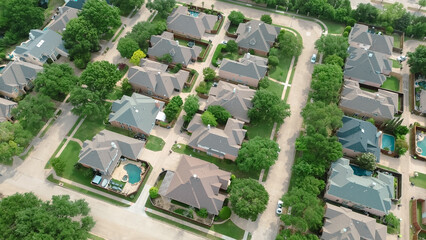 Spacious two-story suburban houses in West Plano, Texas with lush green backyard, modern inground pools, upscale neighborhood green space in rapid growing suburbs Dallas Fort Worth metroplex