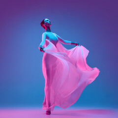 Dynamic photo of dancer lifting pink veil with arms extended symbolizing aesthetic of beauty...