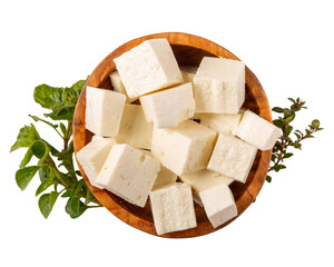 Brynza cheese isolated on white background. Diced soft sheep's cheese bryndza in wooden bowl. Top view.