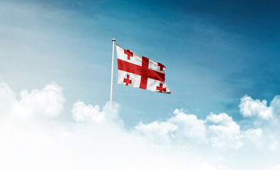 Georgia national flag with mast waving in beautiful sky. Georgia flag for Republic Day and Independence Day.