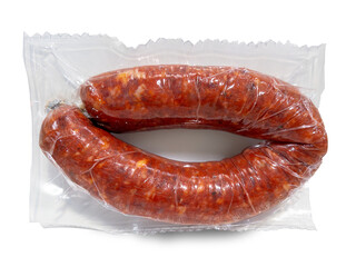 Vacuum-sealed spicy chili sausage isolated