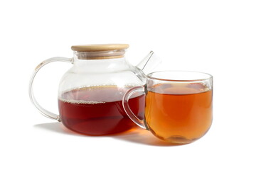 There is a glass teapot with tea on a white background.