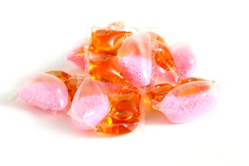 There are washing capsules on a white background.