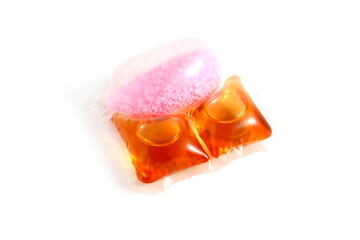 There are washing capsules on a white background.