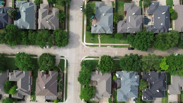 90-degree vertical flyover two story houses in West Plano, Texas with solar panel roof, modern inground pool, upscale neighborhood green space in rapid growing suburbs Dallas Fort Worth metroplex