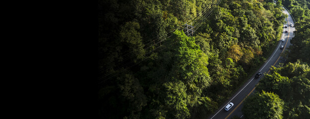 Electric cars to protect the environment and transportation road of Rainforest ecosystem and healthy environment concept , road curve construction up to mountain, panoramic view 