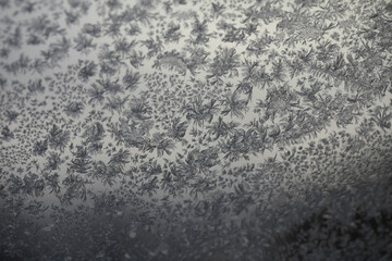 Close-up of Frost Patterns on Winter Windowpane Creating Intricate Natural Designs