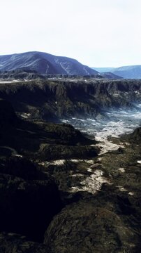 black volcanic basalt rock formations in the low light