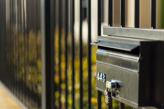 Locked letterbox and security fence