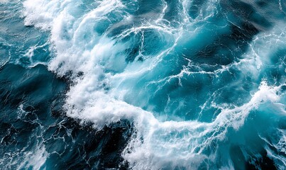Powerful ocean waves, turquoise water, foam, high-angle view; detailed texture of a sea surface, suitable for nature-themed backgrounds or wallpapers