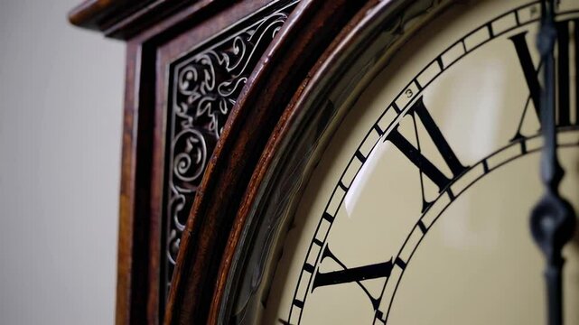 Close up details of an antique wooden clock, showcasing its intricate carvings and roman numerals on the face, with the hands moving to indicate different times - Powered by Adobe