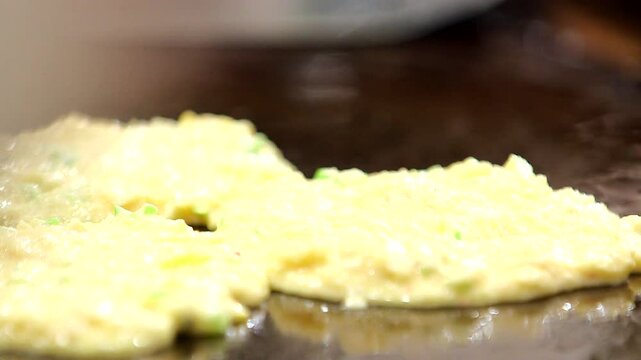 Mung bean pancake batter on an iron plate
