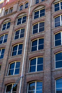 Victorian warehouse architecture with brick and white window framing
