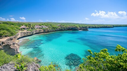 Fototapeta premium Tropical island view with clear blue skies and lush greenery