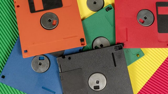 Colorful floppy disks view zoom out 4k video vintage storage concept