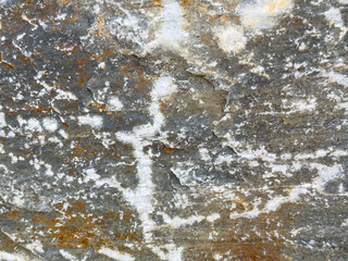 Close-up of weathered rock surface with natural textures and mineral colors