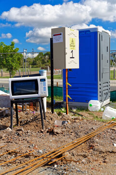 Electrical appliances exposed to the elements, on a chair at a new construction site