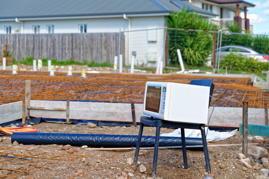 Electrical appliances exposed to the elements, on a chair at a new construction site