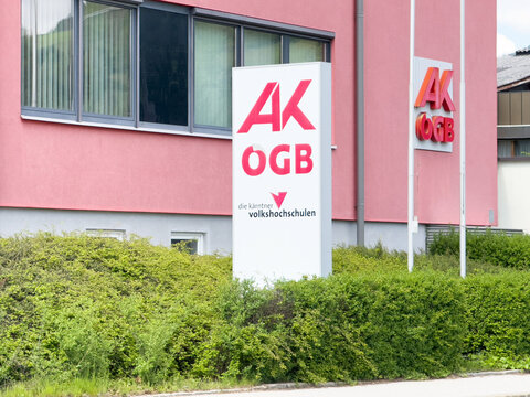 Exterior of ak ogb building with greenery in urban setting
