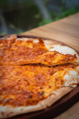 Delicious tuna pizza with spicy and savory taste on cafe table.