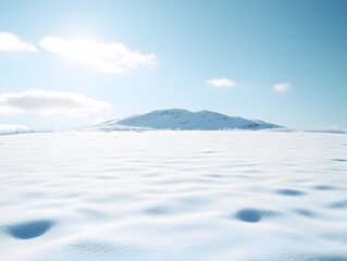 Serene Winter Landscape Snow Covered Field with Distant Mountains under a Blue Sky