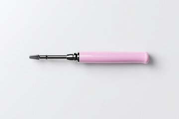 Fototapeta premium Pink screwdriver. A small, pink screwdriver with a metal shaft