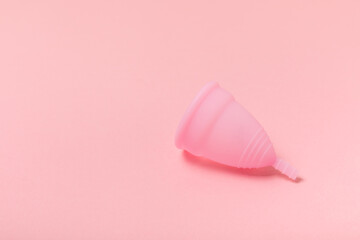 Menstrual cup on a bright background. Sanitary napkins, tampons and menstrual cup.Concept of...