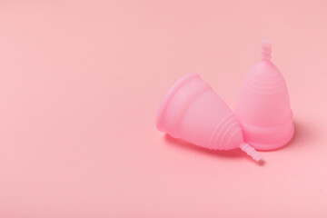 Menstrual cup on a bright background. Sanitary napkins, tampons and menstrual cup.Concept of critical days, menstruation.feminine hygiene product. Women health concept.Premenstrual syndrome.Copy space