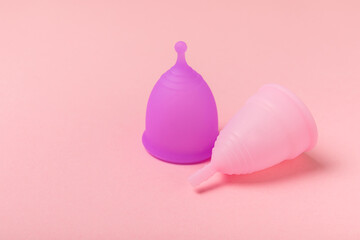 Menstrual cup on a bright background. Sanitary napkins, tampons and menstrual cup.Concept of...