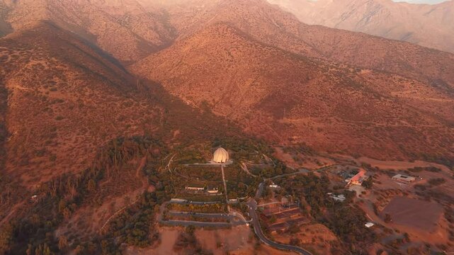 Aerial video of Bahai Temple And Garden In Santiago de Chile during sunset and background of mountains