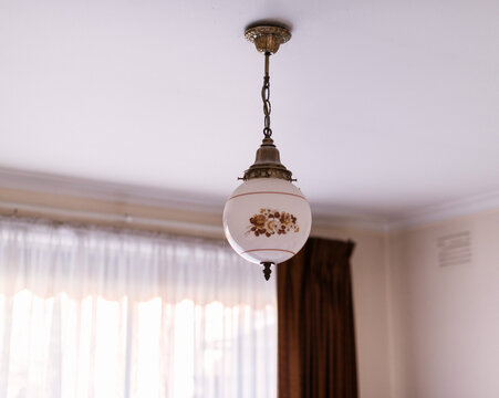 Old fashioned ceiling light hanging in a bedroom