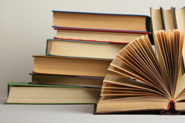 Open book, hardback colorful books on table. Back to school. Copy space for text. Education business concept