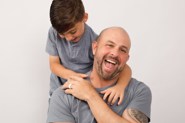 Father's Day, father and son blue shirt, white background 