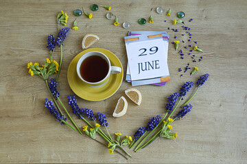 Calendar for June 29: the number 29 and the name of the month June in English on a flip calendar...