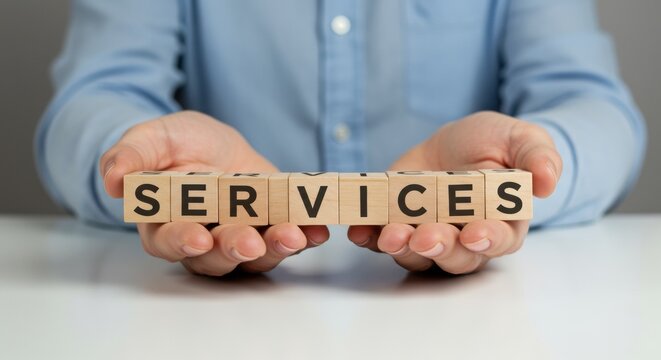 Man holds wooden blocks spelling services business support solutions