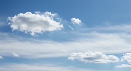 Obraz premium Clouds Floating in a Bright Blue Sky on a Sunny Day