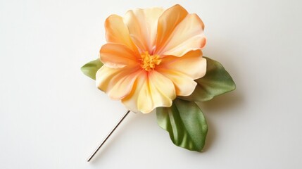 Orange flower brooch, studio shot