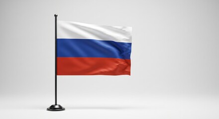 Naklejka premium Russia national flag on a small desk flagpole. Symbol of russian state and country. International relationship and diplomacy concept