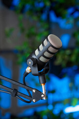 Engaging podcast interview setup with a microphone ready for a live broadcast in a vibrant...