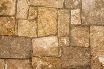 Antique ancient stone wall masonry texture background. Old wall made of beige stone blocks 