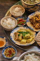 Traditional Vietnamese Food in wooden table with Green background
