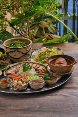 Traditional Vietnamese Food in wooden table with Green background
