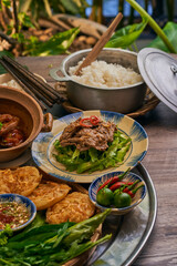 Traditional Vietnamese Food in wooden table with Green background
