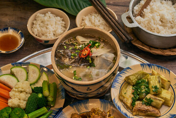 Traditional Vietnamese Food in wooden table with Green background
