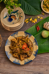 Traditional Vietnamese Food in wooden table with Green background
