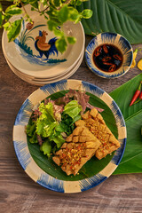 Traditional Vietnamese Food in wooden table with Green background
